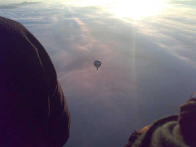 Hot air balloon over the clouds 